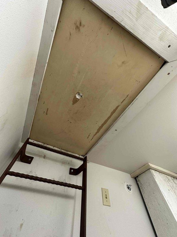 Conducted an Indoor Air Quality (IAQ) assessment of the residential HVAC system, examining the attic-installed air handler with associated ductwork, condensate drainage, and electrical connections. Inspected the ceiling access panel and permanent ladder assembly, noting visible wear and discoloration that could potentially impact indoor air quality.