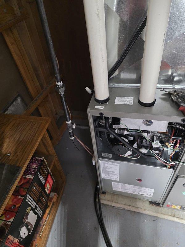 Successfully installed a new high-efficiency furnace with proper ductwork connections and PVC venting. Conducted measurements of the existing ductwork system to ensure optimal airflow configuration. Unit was mounted on a raised platform with all control wiring and mechanical components properly secured and tested for operation.
