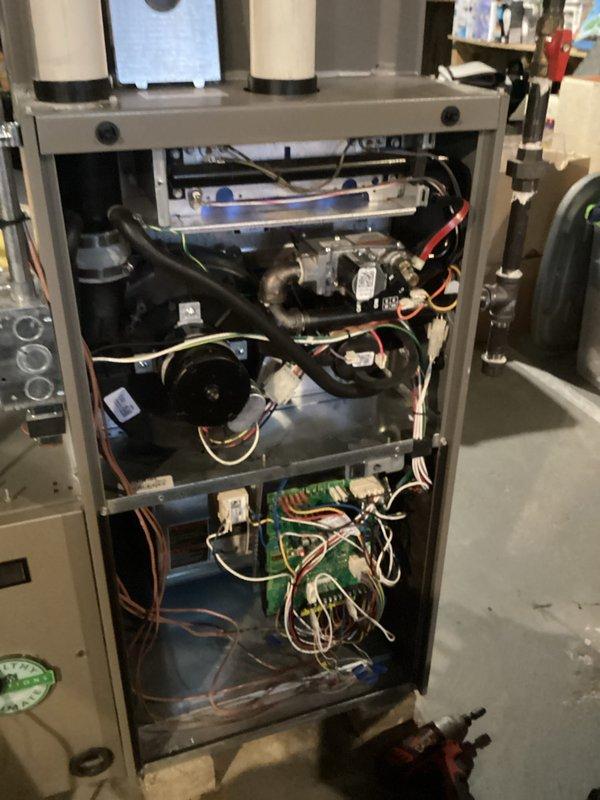 Diagnosed no-heat condition on furnace less than 10 years old by inspecting flame sensor through sight glass and examining internal components including circuit board and blower assembly. Cleaned flame sensor to restore proper flame detection, verified ignition sequence, and confirmed system operation before completing service.