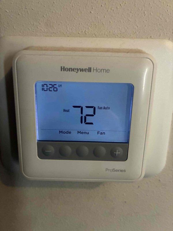 Diagnosed no heat issue in system less than 10 years old. Testing with Fieldpiece SC680 clamp meter revealed low amperage reading of 0.21A and 0.0V, indicating electrical failure. Verified Honeywell Home ProSeries thermostat was functioning correctly with proper heat call signal at 72°F. Repaired electrical connection to restore proper voltage to heating components.