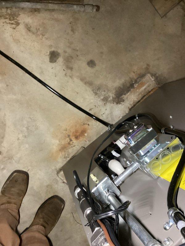 Completed installation of a complete HVAC system in utility area, replacing outdated equipment with new unit featuring advanced filtration components. System was properly positioned on concrete floor with all necessary electrical connections secured and tested for optimal performance.