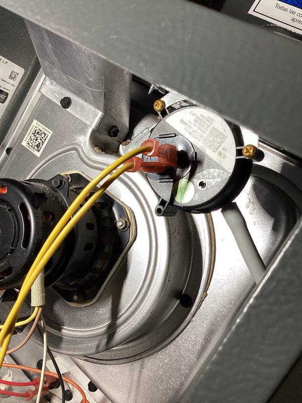 Responded to a no-heat call for a relatively new Goodman furnace installed in basement utility room. Upon inspection, found issues with the blower motor assembly and associated wiring connections. Repaired faulty wiring at the motor terminal, restored proper electrical connections, and verified system operation through complete heating cycle testing.