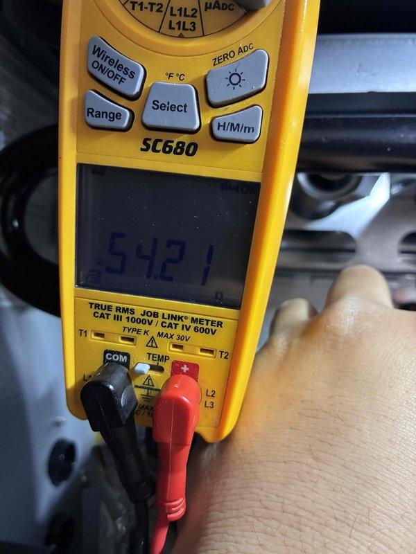 Performed scheduled maintenance visit on HVAC system. Conducted electrical diagnostics using Fieldpiece SC680 multimeter, recording voltage readings of 54.21V. Inspected condensate drain line for proper flow and checked refrigerant lines for integrity and appropriate installation.
