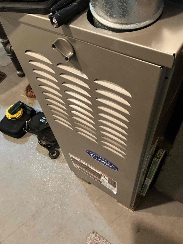 Performed scheduled maintenance on Carrier furnace system. Inspected ductwork connections, refrigerant lines, and associated HVAC components for proper installation and signs of wear. All systems functioning within normal parameters; documented equipment condition with photos for service records.