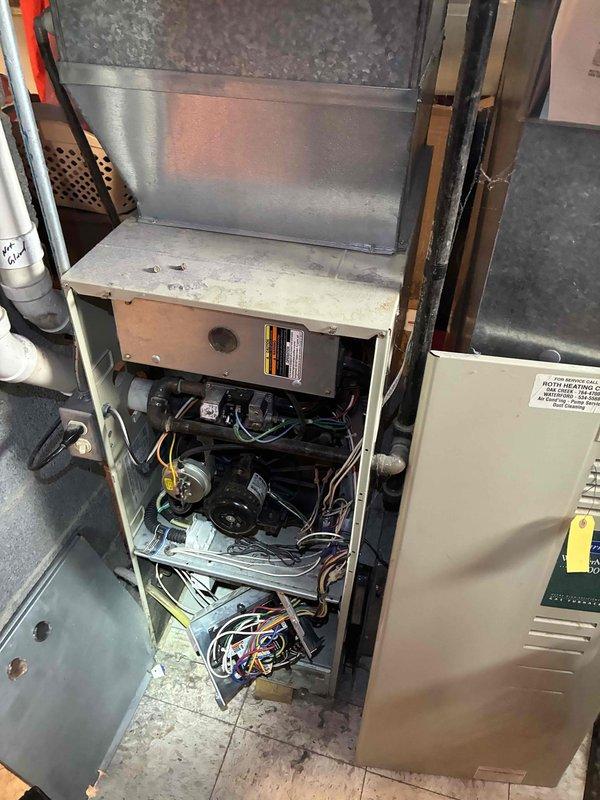 Responded to no-heat call for 10+ year old furnace system. Upon inspection, found significant dust accumulation on internal components requiring thorough cleaning. Thermostat was functioning properly in heat mode but showing 52°F indoor temperature with "Heat On" status, indicating furnace failure to produce adequate heat. Serviced unit by cleaning components, replacing worn igniter, and verifying proper operation with the Honeywell digital thermostat.