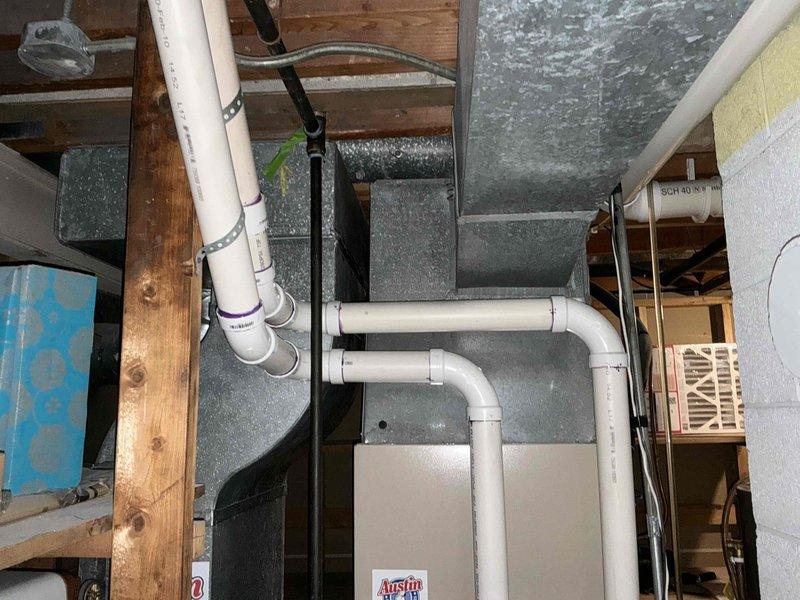 Conducted comprehensive inspection of residential HVAC system including ductwork, ventilation components, and electrical connections. Documented existing installation in unfinished basement with exposed PVC ventilation pipes, galvanized rectangular ductwork, and electrical panel with dedicated HVAC circuits. Provided estimate for complete system replacement based on current configuration and household requirements.