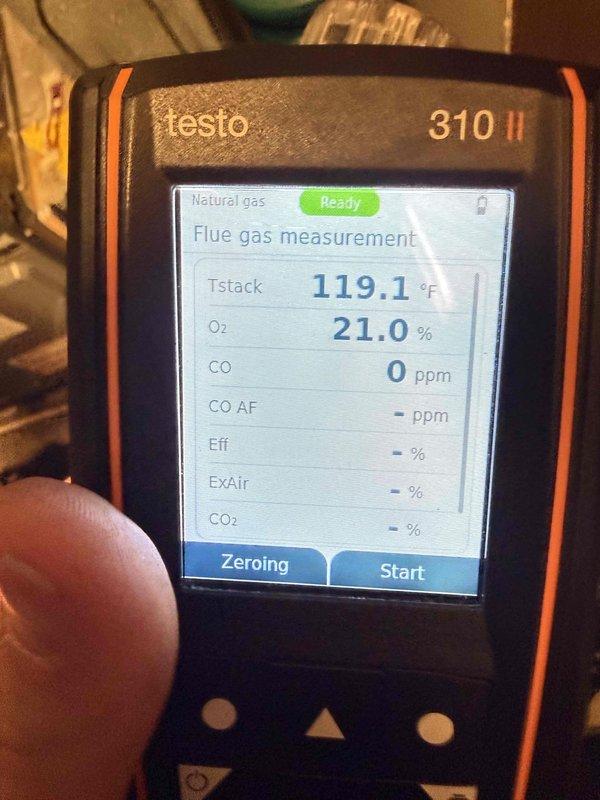 Performed diagnostic inspection on aging furnace showing no heat operation. Opened furnace cabinet to examine control board and wiring connections, noting significant wear on components typical of 10+ year old system. Utilized Testo 310 II flue gas analyzer to test combustion efficiency and safety parameters, confirming normal oxygen levels (21.0%) and zero carbon monoxide emissions while verifying stack temperature at 119.1°F.