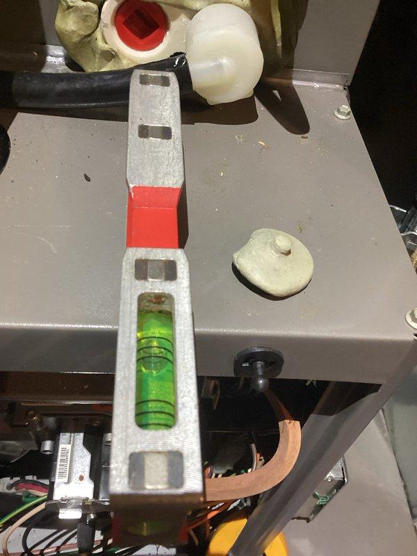Performed routine maintenance on heating system. Verified equipment level for proper installation and operation. Conducted combustion analysis using Testo 310 II gas analyzer, which confirmed unit is operating at 93.7% efficiency with CO levels within safe parameters (14 ppm).