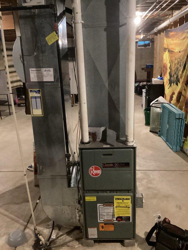 Responded to no-heat call for Rheem Classic 90 Plus furnace. Diagnosed failed blower motor, removed defective unit, and installed new replacement motor with proper wiring connections. System restored to normal operation with verified heating function.