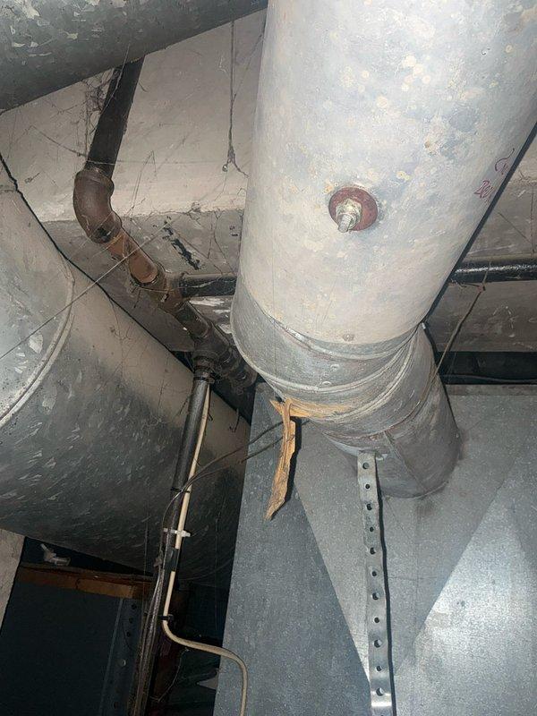 Conducted assessment of aging HVAC system in utility space. Identified deteriorated ductwork with compromised insulation and oxidized copper piping connections. Recommended full system replacement including properly insulated ductwork, updated ventilation components, and replacement of corroded plumbing connections to restore optimal system efficiency and prevent potential failures.