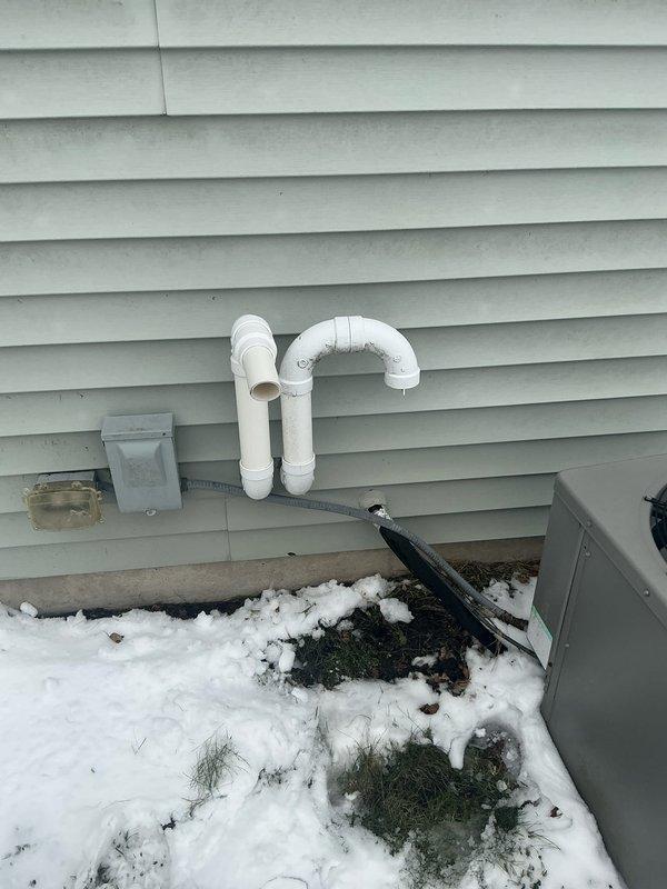 Conducted comprehensive evaluation of existing HVAC system in basement utility room. Documented condition of central furnace unit, associated ductwork, and exterior components including PVC venting configuration and utility connections. Prepared detailed replacement estimate for complete system upgrade.