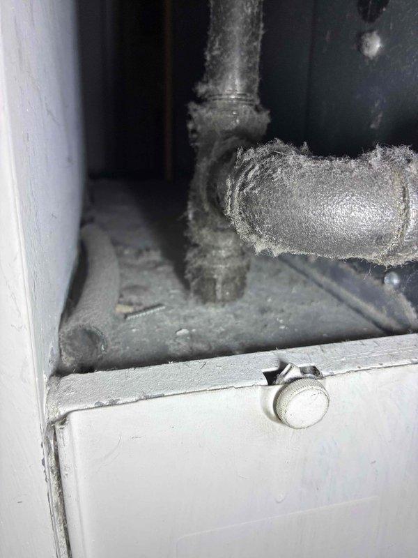 Responded to a gas leak service call where ice/frost buildup was observed on metal pipes at connection points, indicating a significant refrigerant leak in the HVAC system. Inspected PVC drainage components and sealed joints with appropriate materials to prevent further issues. Repaired the leak at the affected elbow joint and recharged the system to proper operating specifications.
