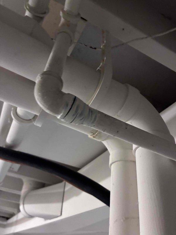 Responded to a gas leak service call where ice/frost buildup was observed on metal pipes at connection points, indicating a significant refrigerant leak in the HVAC system. Inspected PVC drainage components and sealed joints with appropriate materials to prevent further issues. Repaired the leak at the affected elbow joint and recharged the system to proper operating specifications.