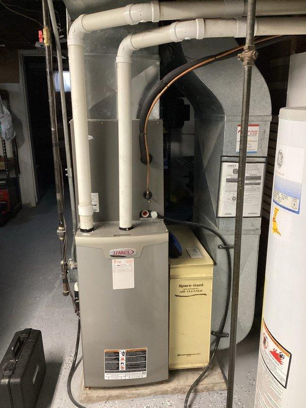 Performed routine maintenance on Trane HVAC system including inspection of furnace/air handler unit, connected PVC exhaust/condensate lines, and adjacent Space Gard air purification system. Visual inspection of ductwork revealed some discoloration and minor staining which was noted but does not currently affect system performance.