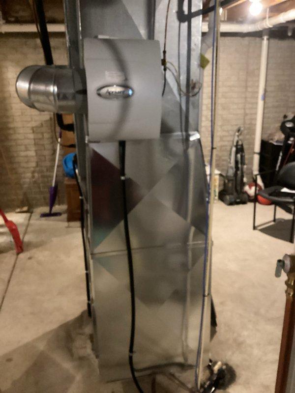 Successfully installed a new high-efficiency furnace in basement utility area, including proper connection to existing ductwork system and installation of PVC intake/exhaust venting. Unit was properly positioned on concrete floor with all electrical connections secured according to manufacturer specifications and verified for optimal operation.