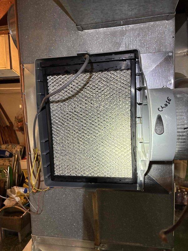 Performed inspection of Aprilaire humidifier system and found indoor relative humidity at 27%. Examined air filter assembly and humidifier control panel (Model 60) for proper function. No service indicator lights were active during assessment.