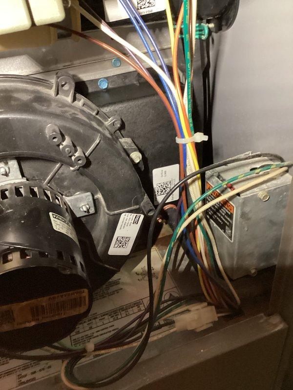 Diagnosed and replaced failing blower motor assembly in residential furnace unit. Installed new motor with proper wiring connections to control board, securing all electrical components with zip ties for safety. Tested system operation to confirm proper functionality after replacement.