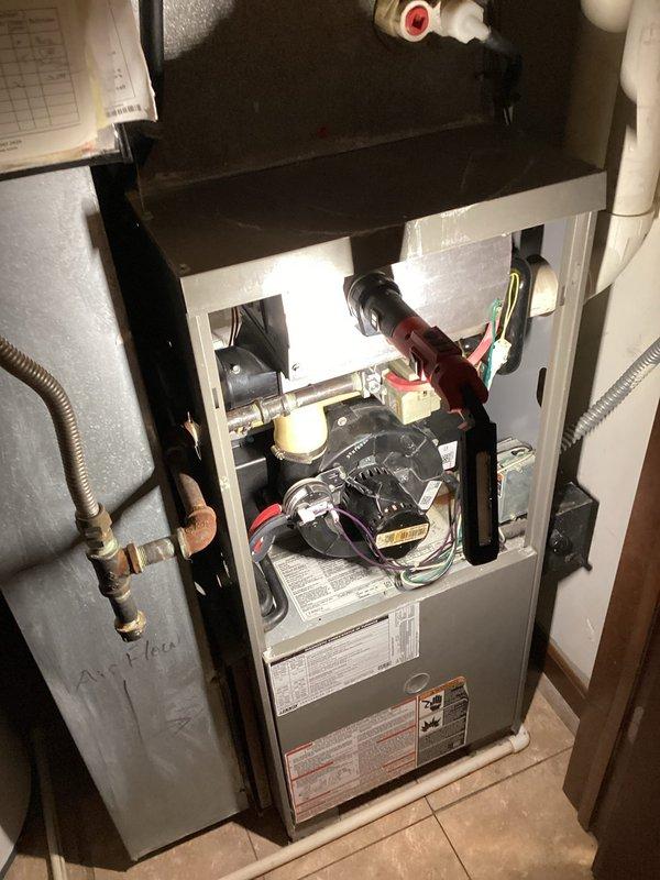 Diagnosed and replaced failing blower motor assembly in residential furnace unit. Installed new motor with proper wiring connections to control board, securing all electrical components with zip ties for safety. Tested system operation to confirm proper functionality after replacement.