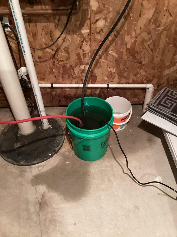 Inspected basement sump pump system and hydronic heating installation. Found water backup issue in sump basin requiring pump replacement. Verified proper operation of expansion tank, zone valves, and pressure gauges on boiler system after service.