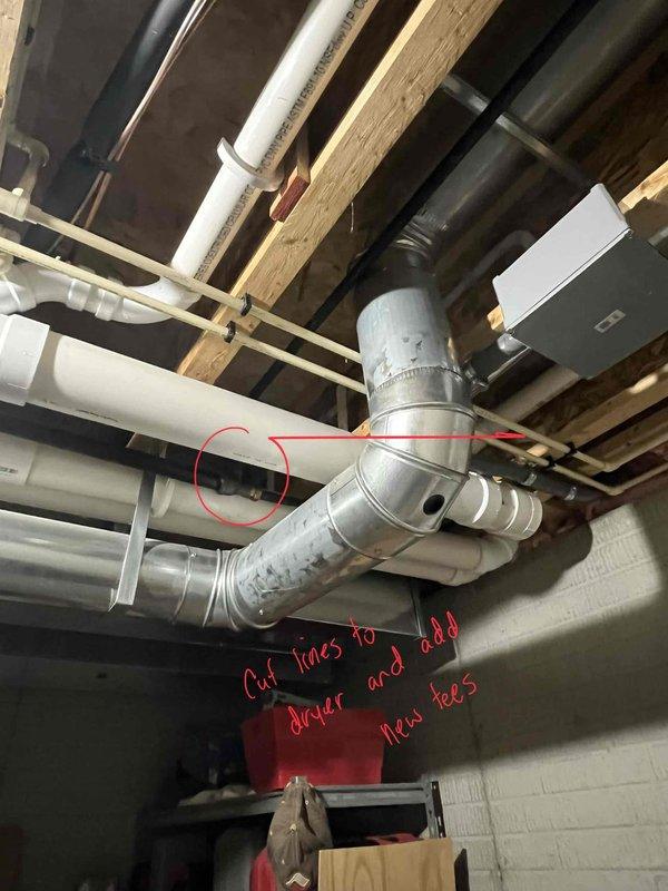 Completed HVAC furnace installation with proper ductwork integration in basement utility area. Modified existing plumbing configuration by cutting dryer lines and installing new tees as required. Created appropriate access hole for A/C refrigerant lines through exterior wall to complete system setup.