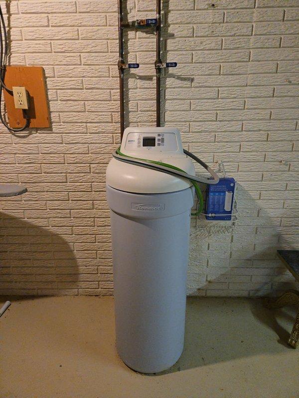 # Plumbing Service - Inspection Summary

Conducted comprehensive plumbing inspection of residential basement mechanical room and water treatment system. Inspected Coleman water softener installation including copper supply lines, multiple ball valve shutoff points, and proper electrical connections. Verified water softener control panel operation and examined plumbing configuration for compliance with installation standards.

Evaluated furnace area plumbing connections including gas line routing, PVC exhaust/intake venting system, and associated mechanical equipment installations. Inspected all visible piping for proper support, secure fittings, and absence of leaks or corrosion. Confirmed adequate clearances around equipment and proper installation against foundation walls. Documented current condition of all plumbing components with photographic evidence for service records.

All inspected systems found to be functioning within normal parameters with professional-grade installations 