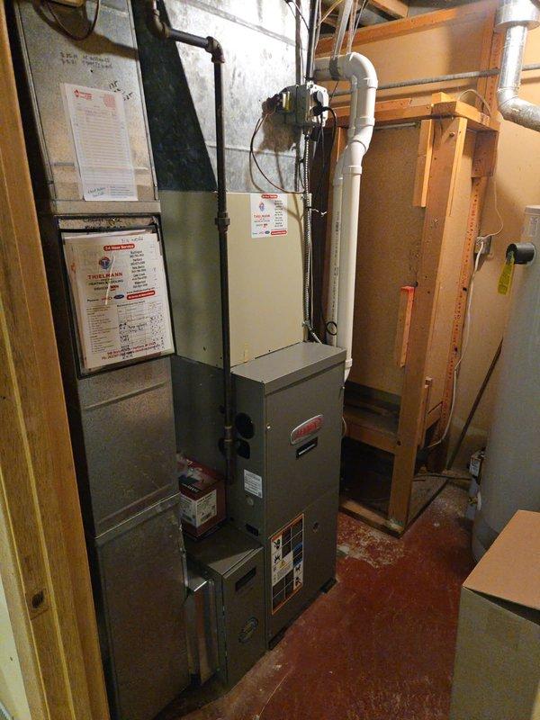 # Plumbing Service - Inspection Summary

Conducted comprehensive plumbing inspection of residential basement mechanical room and water treatment system. Inspected Coleman water softener installation including copper supply lines, multiple ball valve shutoff points, and proper electrical connections. Verified water softener control panel operation and examined plumbing configuration for compliance with installation standards.

Evaluated furnace area plumbing connections including gas line routing, PVC exhaust/intake venting system, and associated mechanical equipment installations. Inspected all visible piping for proper support, secure fittings, and absence of leaks or corrosion. Confirmed adequate clearances around equipment and proper installation against foundation walls. Documented current condition of all plumbing components with photographic evidence for service records.

All inspected systems found to be functioning within normal parameters with professional-grade installations 