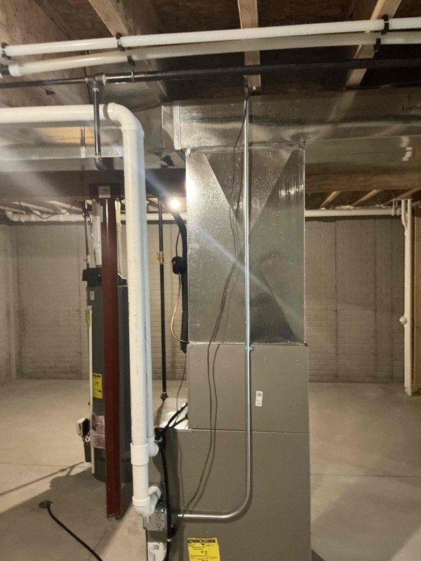 # HVAC Estimate - IAQ Summary

Conducted comprehensive indoor air quality assessment of existing residential HVAC system in basement utility area. Evaluated current Carrier brand furnace and air handler configuration, including ductwork connections, ventilation components, and condensate drainage system. Documented equipment specifications, installation layout, and identified opportunities for IAQ enhancement through potential addition of air filtration systems, UV germicidal lights, or whole-home humidification solutions to improve overall air quality and system performance.