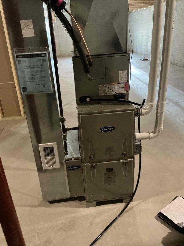 # HVAC Estimate - IAQ Summary

Conducted comprehensive indoor air quality assessment of existing residential HVAC system in basement utility area. Evaluated current Carrier brand furnace and air handler configuration, including ductwork connections, ventilation components, and condensate drainage system. Documented equipment specifications, installation layout, and identified opportunities for IAQ enhancement through potential addition of air filtration systems, UV germicidal lights, or whole-home humidification solutions to improve overall air quality and system performance.