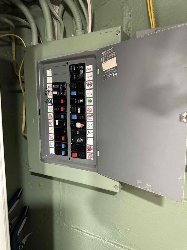 # HVAC System Replacement Estimate

Conducted comprehensive site evaluation for complete HVAC system replacement at residential property. Assessed existing outdoor condenser unit positioned on concrete pad against vinyl siding, noting equipment age and operational status. Evaluated electrical infrastructure including main breaker panel with existing circuit configuration to determine electrical service adequacy and required modifications for new equipment installation. Documented current system specifications, mounting location accessibility, and clearance requirements for replacement unit sizing and placement recommendations.