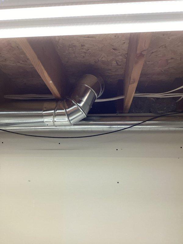 # HVAC Install - Ductwork Service Report

Completed installation of new ductwork system in residential attic space, including rigid metal supply ducts with flexible elbow connections to ensure proper airflow routing around structural beams. Installed new wall-mounted air return vent register in living space with proper integration to existing HVAC system, securing all connections and verifying adequate air circulation throughout the conditioned area.