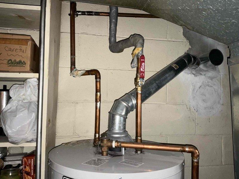 # HVAC Estimate - Replacement Summary

Conducted comprehensive assessment of existing Bradford White Defender Safety System water heater installation for replacement estimate. Unit currently installed in basement utility room with copper supply and discharge piping, pressure relief valve assembly, and associated connections. Evaluated existing plumbing configuration including hot and cold water lines, shut-off valves, and venting system. Documented current installation specifications, pipe routing, clearances, and accessibility for replacement planning. Assessed utility room conditions, available workspace, and structural considerations necessary for efficient equipment removal and new unit installation.