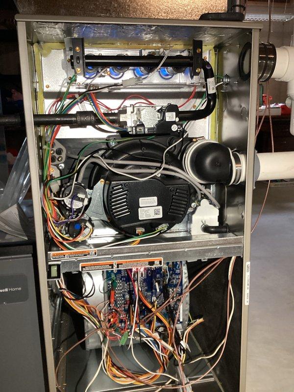 Completed prepaid HVAC maintenance inspection on gas furnace system. Removed access panel and performed thorough visual examination of all internal components including gas valve manifold, burner assembly, blower motor, inducer fan, control boards, electrical connections, and condensate drainage system. All components were found to be in proper working condition with clean, well-maintained appearance and no visible signs of wear, damage, or deterioration noted during inspection.