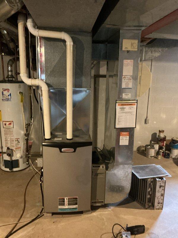 Completed comprehensive HVAC tune-up service on Lennox furnace system in basement mechanical room. Performed standard maintenance inspection of heating equipment, verified proper operation of all components including ductwork connections, PVC condensate drainage system, and heat exchanger assembly. All systems tested and found operating within normal parameters.