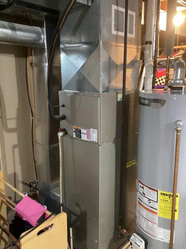 Completed indoor air quality inspection and assessment of residential HVAC system including Carrier furnace and associated mechanical equipment. Documented current system configuration, verified proper equipment operation, and photographed installation for service records. All components found operating within normal parameters with no immediate IAQ concerns identified at time of inspection.