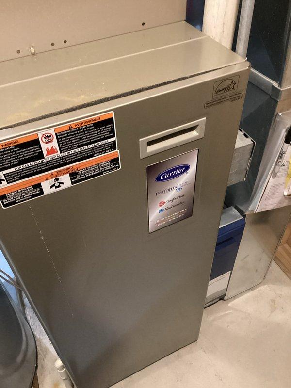 Completed indoor air quality inspection and assessment of residential HVAC system including Carrier furnace and associated mechanical equipment. Documented current system configuration, verified proper equipment operation, and photographed installation for service records. All components found operating within normal parameters with no immediate IAQ concerns identified at time of inspection.