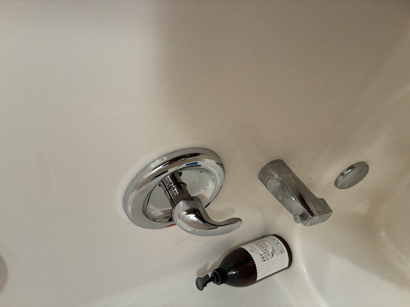 # Plumbing Service - Broken/Burst Pipe

Responded to emergency call for burst pipe repair in residential property. Upon arrival, assessed water damage and located compromised copper supply line behind bathroom wall. Shut off main water supply to prevent further flooding and property damage.

Removed section of damaged drywall to access plumbing system. Found corroded copper pipe with pinhole leak that had expanded due to water pressure, causing significant water discharge into wall cavity and bathroom area. Extracted affected pipe section and inspected surrounding plumbing infrastructure for additional compromise.

Installed new copper pipe segment using compression fittings and proper soldering techniques to ensure watertight seal. Verified all connections met code requirements and tested system integrity under full water pressure. Confirmed no additional leaks present at joints or surrounding plumbing fixtures including tub spout and shower assembly.

Restored water supply and conduc