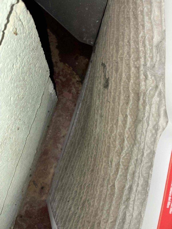 # HVAC Service - Furnace

Performed routine furnace inspection and documented existing building conditions. Photographed exterior structural junction showing weathered components and interior plumbing system with heavily corroded metal piping requiring future attention. Observed rusted heating system pipes with significant oxidation at connection points and brackets, indicating potential replacement needs to prevent system failure.