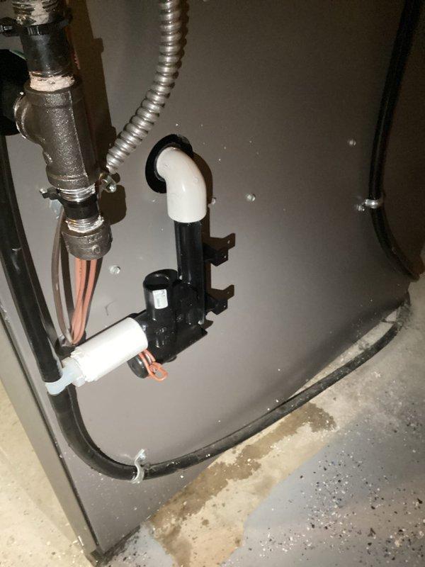 Completed furnace repair involving inspection and servicing of internal heating system components. Accessed furnace cabinet to examine electrical connections, pressure switches, gas valve assembly, and condensate drainage system. Verified proper operation of safety controls and tested all electrical connections throughout the unit. Inspected and serviced PVC condensate drain lines and mounting hardware to ensure proper drainage function. All components tested and confirmed operational upon completion of service work.