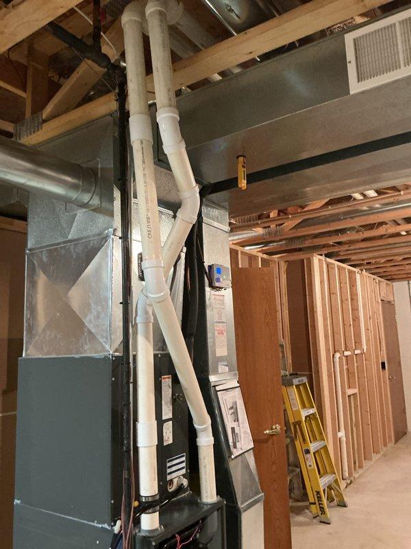 Completed preventative maintenance tune-up on Daikin furnace system in residential basement installation. Performed comprehensive inspection of unit, verified proper operation of all safety controls, checked and cleaned burner assembly, inspected heat exchanger for cracks or deterioration, tested ignition system functionality, and confirmed adequate combustion air supply and proper venting through white PVC piping. Verified all electrical connections were secure, measured temperature rise across heat exchanger within manufacturer specifications, and ensured ductwork connections were properly sealed to maximize system efficiency.