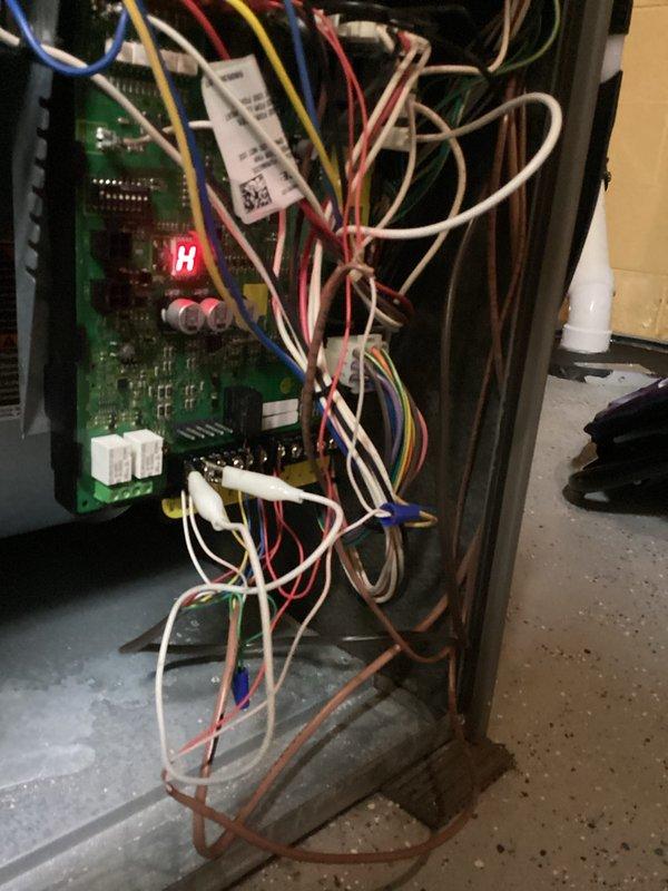 Responded to service call back for HVAC system inspection and diagnostics. Upon arrival, accessed furnace unit and control board displaying "H" error code on LED display. Performed thorough system evaluation including inspection of wiring connections, blower motor assembly, refrigerant lines, and electrical components. Verified all wire terminations at control board, checked for loose connections, and ensured proper seating of wire harnesses in white plastic connectors. Inspected condition of rubber boots on vertical discharge pipes and confirmed secure mounting of unit. System tested and operational parameters verified within manufacturer specifications.