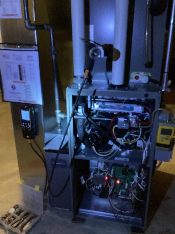 Performed comprehensive tune-up and safety inspection on residential gas furnace system. Accessed internal components, verified proper electrical connections including control board and gas valve wiring harnesses, tested Honeywell gas valve operation, and confirmed all safety controls functioning correctly. System inspected, cleaned, and returned to normal operation with all access panels secured.