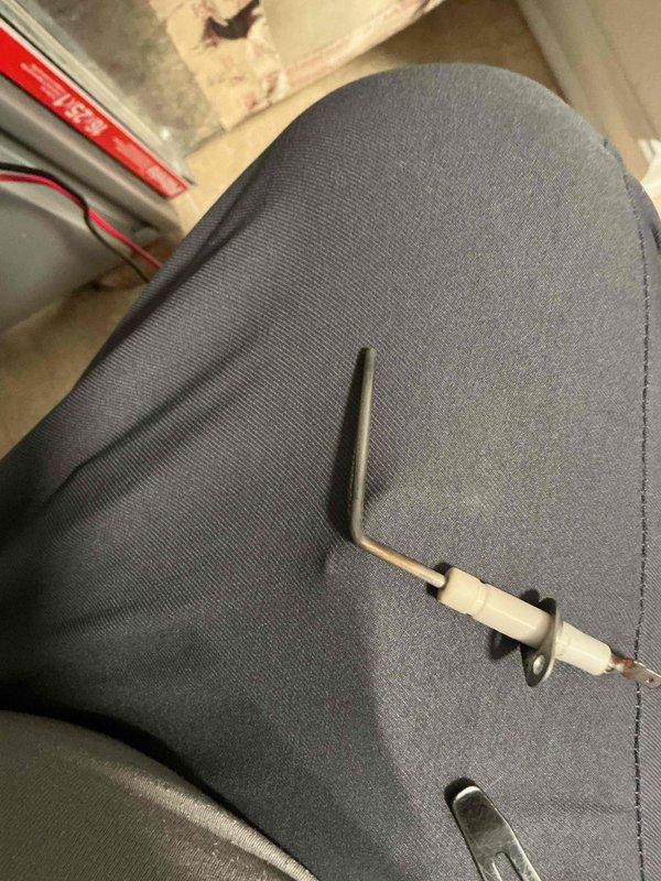 Completed prepaid HVAC maintenance visit and performed system inspection. Examined flame sensor electrode, which showed signs of carbon buildup, and inspected pipe insulation for proper sealing and condition. All components were evaluated for proper operation and system readiness.