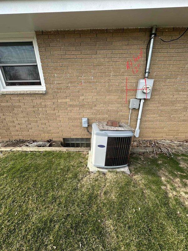 Completed comprehensive estimate for complete HVAC system replacement at residential property. Evaluated existing outdoor condensing unit positioned against exterior brick wall with current electrical disconnect and conduit routing, as well as interior electrical panel and distribution system in basement utility area. Assessment included documentation of existing equipment placement, electrical service configuration with dual-column circuit breaker panel, and current ductwork installation to provide detailed replacement specifications and equipment sizing recommendations for new high-efficiency heating and cooling system installation.