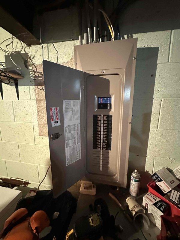 Completed comprehensive estimate for complete HVAC system replacement at residential property. Evaluated existing outdoor condensing unit positioned against exterior brick wall with current electrical disconnect and conduit routing, as well as interior electrical panel and distribution system in basement utility area. Assessment included documentation of existing equipment placement, electrical service configuration with dual-column circuit breaker panel, and current ductwork installation to provide detailed replacement specifications and equipment sizing recommendations for new high-efficiency heating and cooling system installation.
