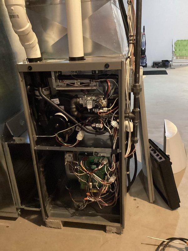 Completed comprehensive tune-up maintenance on residential gas furnace system. Performed full system inspection including gas valve operation, control board functionality, electrical connections, and venting components. Verified proper operation of all safety controls, confirmed adequate combustion air supply through PVC intake piping, and ensured exhaust venting meets code requirements.