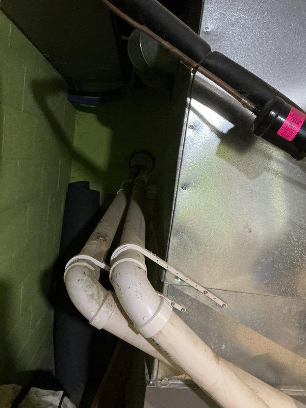 Completed comprehensive HVAC tune-up service including inspection of condensate drainage system and verification of equipment levelness. Examined PVC drain line configuration, condensate pan, and associated piping within the unit cabinet, noting proper drainage flow and checking for any signs of blockage or mineral buildup. Confirmed unit is properly leveled to ensure adequate condensate removal and optimal system operation.