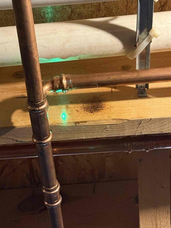 Completed comprehensive HVAC system tune-up in attic mechanical space, inspecting all ductwork connections, PVC condensate drain lines, and copper refrigerant lines for proper operation. Verified all sheet metal plenums, flexible ductwork, and pipe joints showed no signs of leakage or deterioration, with all components functioning within normal parameters.