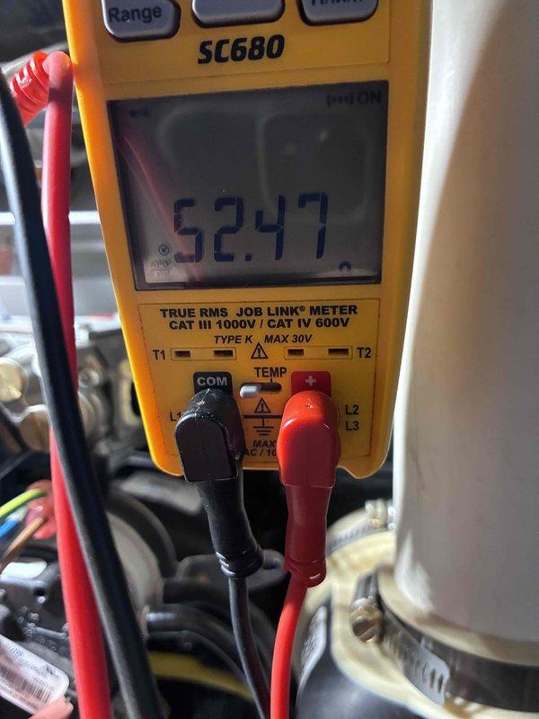 Performed comprehensive HVAC tune-up and system diagnostics on heating equipment. Conducted electrical testing using digital multimeter, recording voltage readings of 52.47V to verify proper power supply and system operation. Inspected gas valve assembly, control wiring, and electrical connections for proper operation and safety compliance. All components including capacitor, control board wiring, and gas valve assembly found to be functioning within manufacturer specifications with normal wear patterns for equipment age.