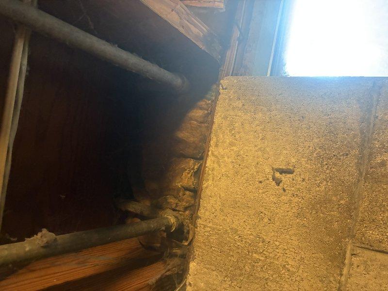 Responded to emergency call for broken pipe in basement mechanical space. Upon arrival, located compromised copper water line running along ceiling joists near HVAC ductwork system. Isolated water supply to affected section and drained remaining water from damaged pipe segment. Removed corroded section of pipe showing significant oxidation and age-related deterioration. Cut and removed approximately 18 inches of compromised copper piping, deburred pipe ends, and cleaned connection points. Installed new copper pipe section using proper sweat-soldering techniques with lead-free solder to ensure code-compliant connections. Tested all joints for leaks under full pressure, confirmed system integrity, and restored water supply to building. Inspected surrounding piping infrastructure for additional signs of corrosion or potential failure points given the age of the existing plumbing system.