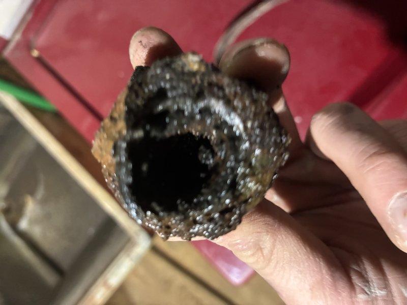 Responded to a plumbing service call for shower/tub issues and performed an inspection of the water supply system. Upon investigation, discovered severely corroded galvanized piping with extensive mineral buildup and scale accumulation that had significantly restricted water flow and reduced the internal diameter of the pipes. Replaced the deteriorated pipe section with new copper piping, installing compression fittings to ensure proper connections. The old pipe exhibited heavy corrosion throughout, with thick crusty deposits coating the interior walls, which was causing reduced water pressure and flow issues to the shower/tub fixtures. Completed the pipe replacement in the basement/crawl space area, securing all new copper lines properly along the existing floor joists to restore full water flow capacity to the bathroom fixtures.